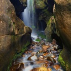 Crevice waterfall near Camas Sgiotaig (Singing Sands), Eigg